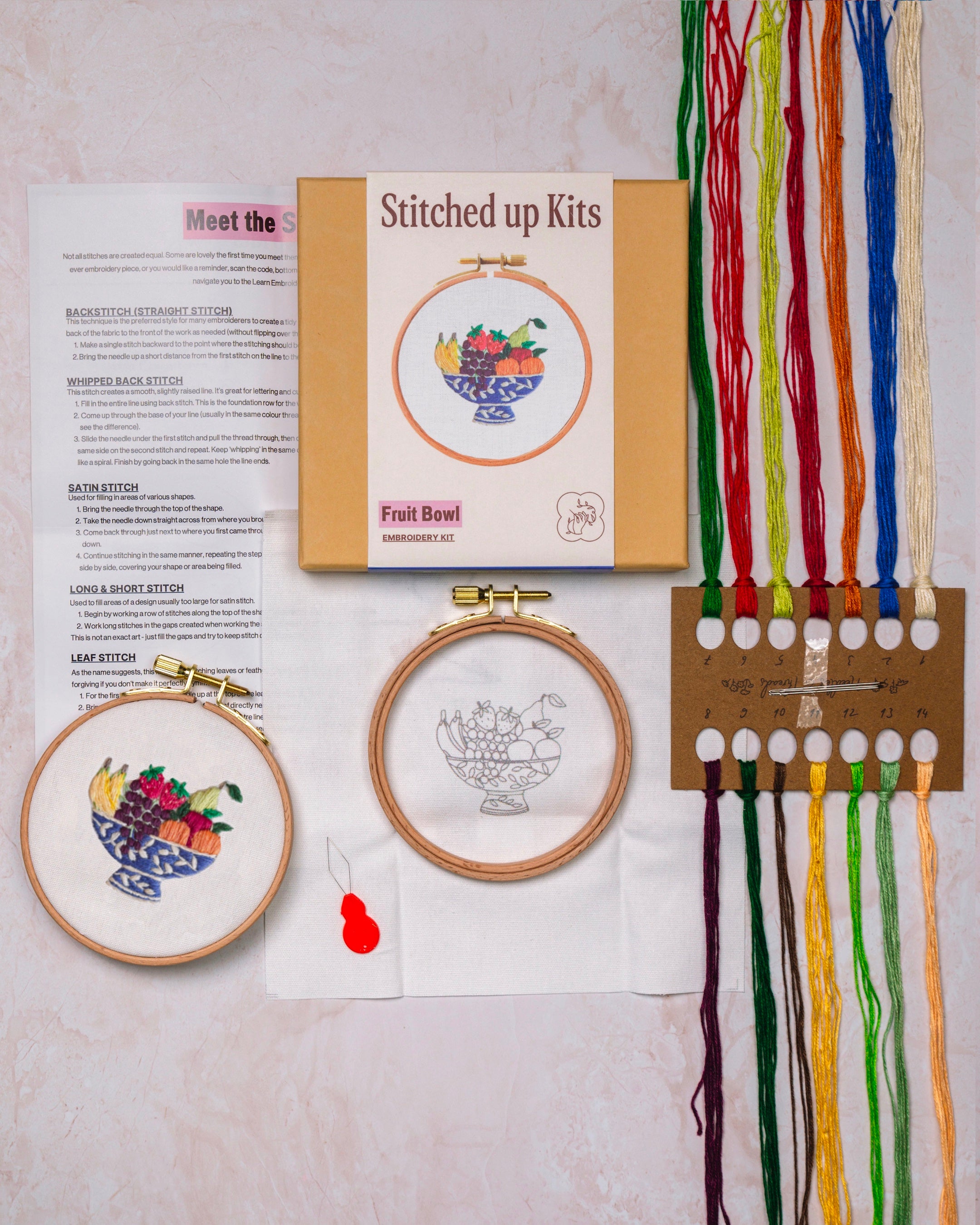 Embroidery kit with threads and needles and hoops
