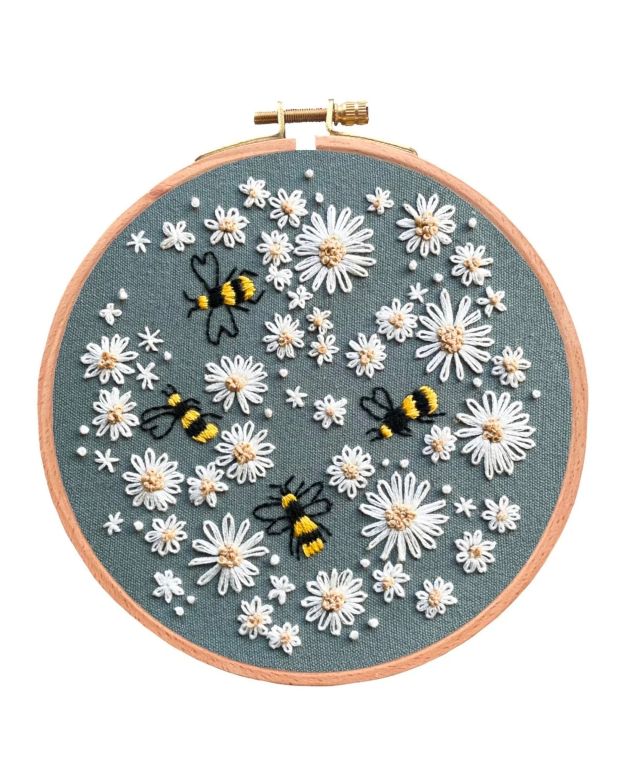 Busy Bumble Bees embroidery hoop featuring white daisies and three bees on gray fabric with wooden frame