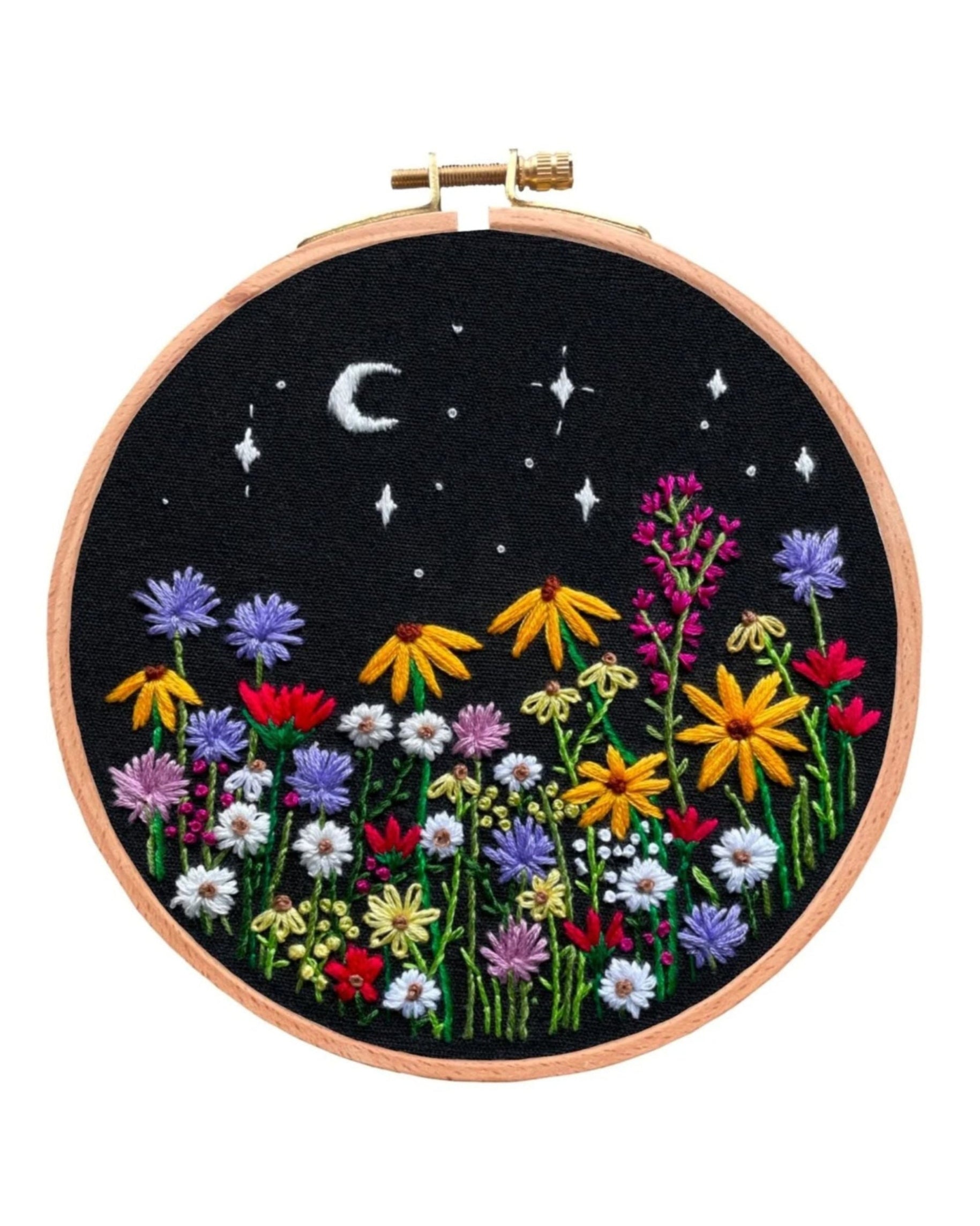 Luna Wildflowers embroidery hoop featuring colorful wildflowers under a starry night sky with crescent moon on black fabric